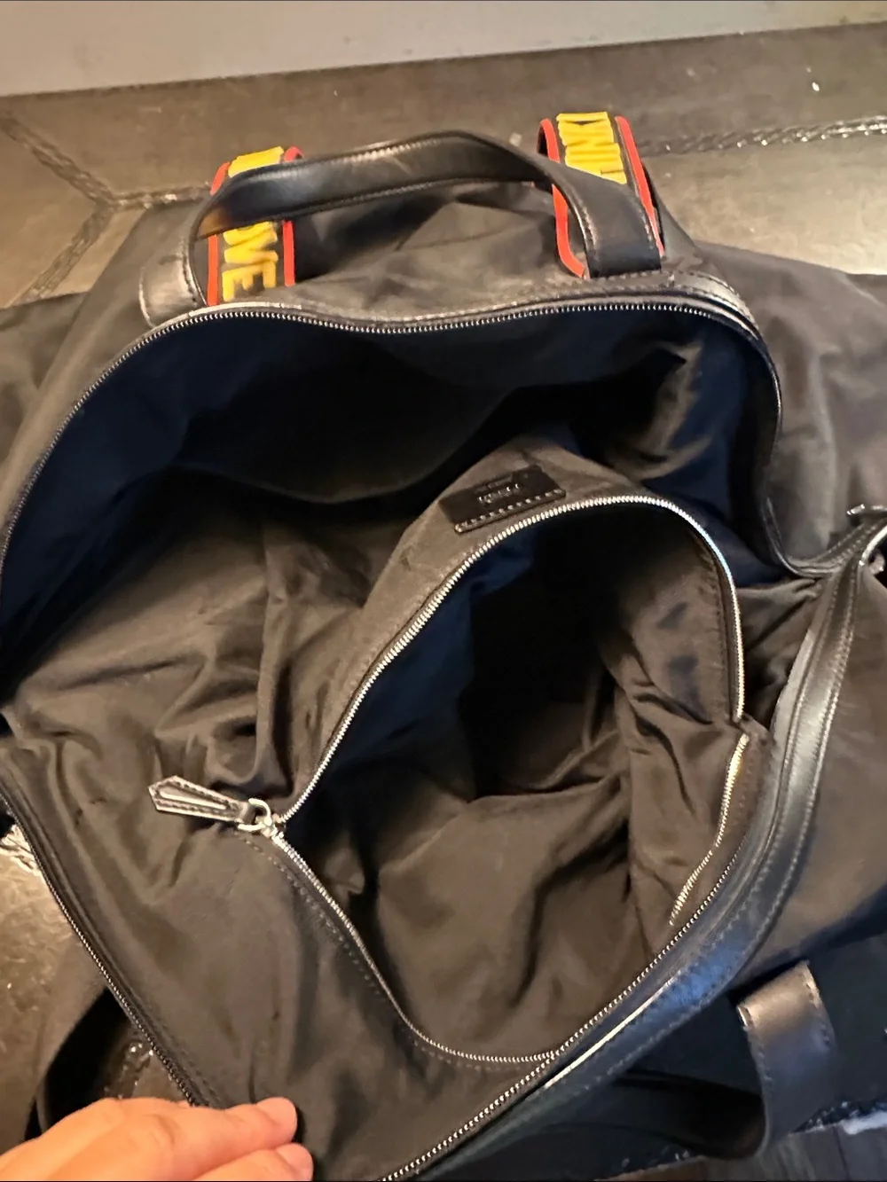 Fendi Black Duffel Bag with Yellow and Red Logo Straps